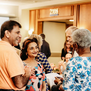 Group of people standing around smiling and talking. Read about Donor-Advised Funds Group of people standing around smiling and talking. Read about Donor-Advised Funds